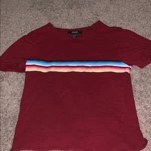 red t-shirt with rainbow stripe